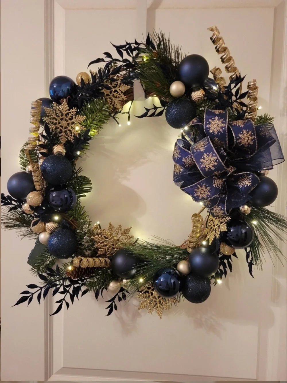Navy and Gold Holiday Wreath with Decorative Bow